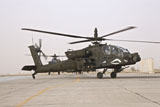 TMO100838M
An AH-64 Apache helicopter taxiing on the flight line.