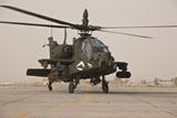 TMO100840M
An AH-64 Apache helicopter taxiing on the flight line.