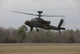 TMO100851M
An AH-64 Apache helicopter in midair, Conroe, Texas.