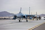 TMO100881M
F-15C Eagles taxi to the runway at Nellis Air Force Base, Nevada.