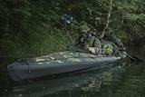 TWE300001M
Navy SEALs navigate the waters in a folding kayak during jungle warfare operations.