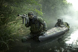 TWE300003M
Navy SEALs navigate the waters in a folding kayak during jungle warfare operations.