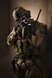 TWE300023M
U.S. Air Force CSAR parajumper armed with an automatic rifle.