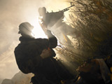 TWE300044M
U.S. Navy SEALs give first aid to a wounded soldier.