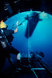 WOD100095M
A SEAL Delivery Vehicle breaks away from the Dry Deck Shelter on a submarine.