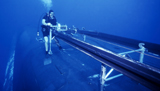 WOD100117M
A crewman cranks out the Dry Deck Shelter cradle from USS Kamehameha.