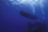 WOD100149M
A SEAL Delivery Vehicle approaches the Dry Deck Shelter aboard USS Kamehameha.