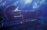 WOD100151M
A SEAL Delivery Vehicle navigates onto the Dry Deck Shelter on USS Kamehameha.