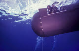 WOD100175M
A pilot guides a SEAL Delivery Vehicle to a tether line.