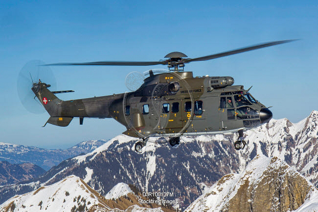 A Swiss Air Force AS332 Super Puma tactical transport helicopter flying ...