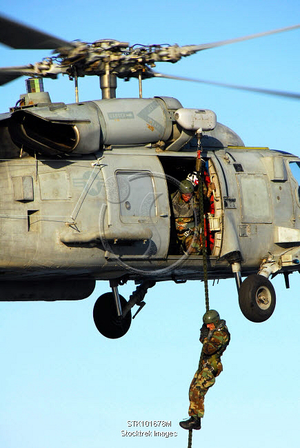 Seahawk Fast Roping Soldier fast ropes from an SH-60 Seahawk. | Stocktrek Images