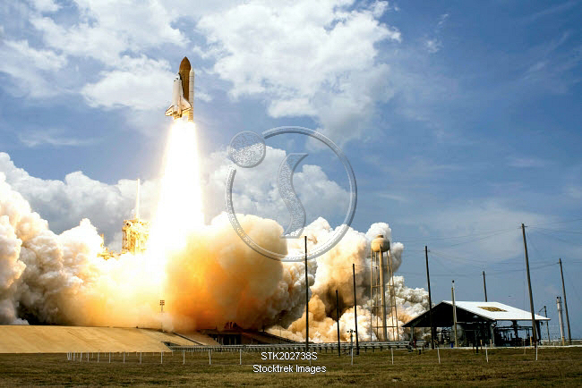 Space Shuttle Atlantis lifts off from its launch pad. | Stocktrek Images