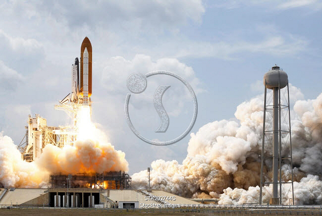 Space Shuttle Atlantis lifts off from its launch pad. | Stocktrek Images
